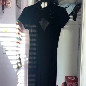 Black long dress with velvet fabric on the outside and a mesh cut out